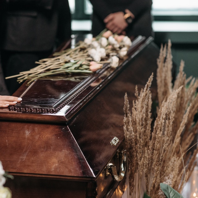 A family and a Pastor in a Funeral Service